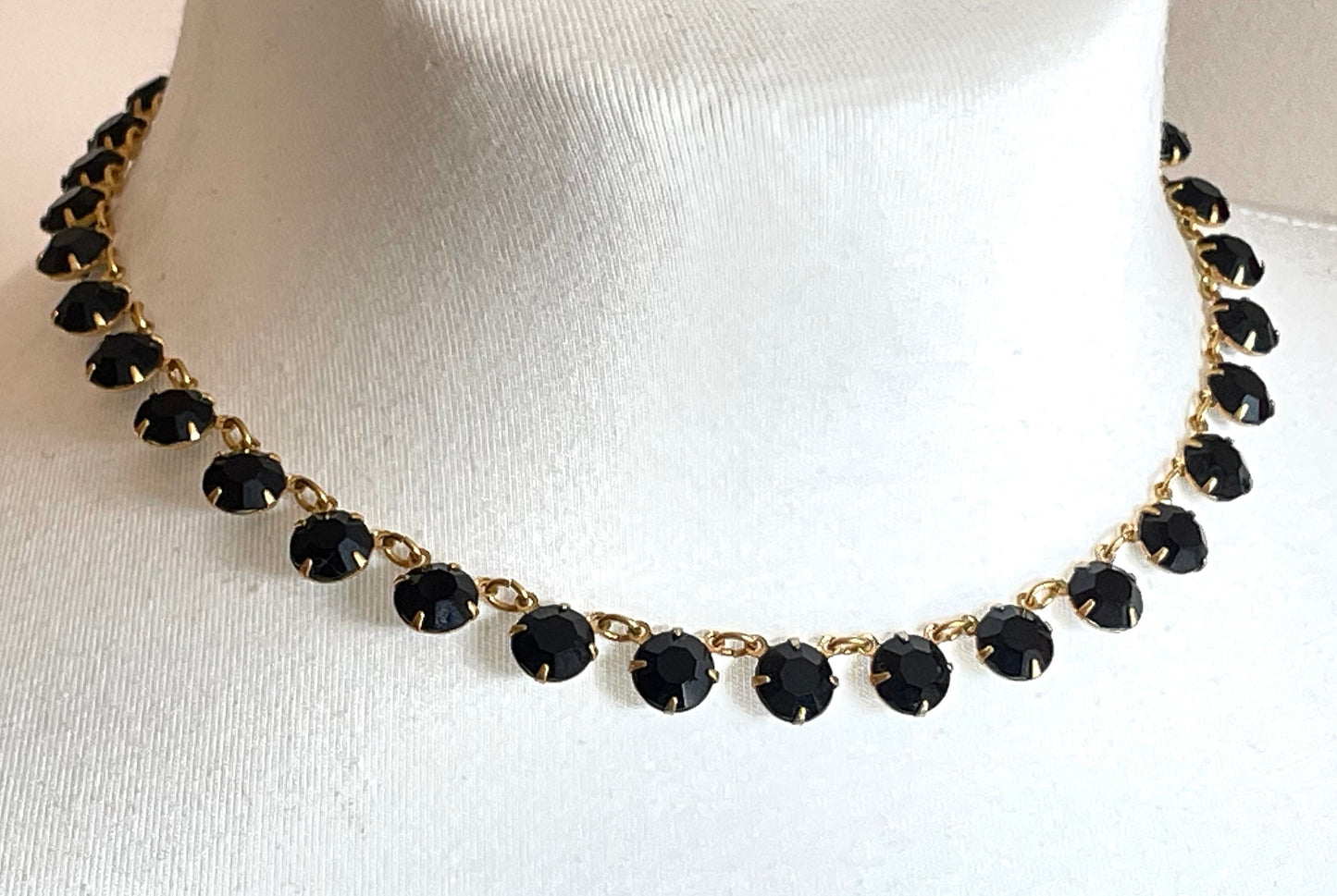 Vintage Art Deco black French jet crystal riviere necklace, single strand, bezel set, open backed rhinestones in gold tone