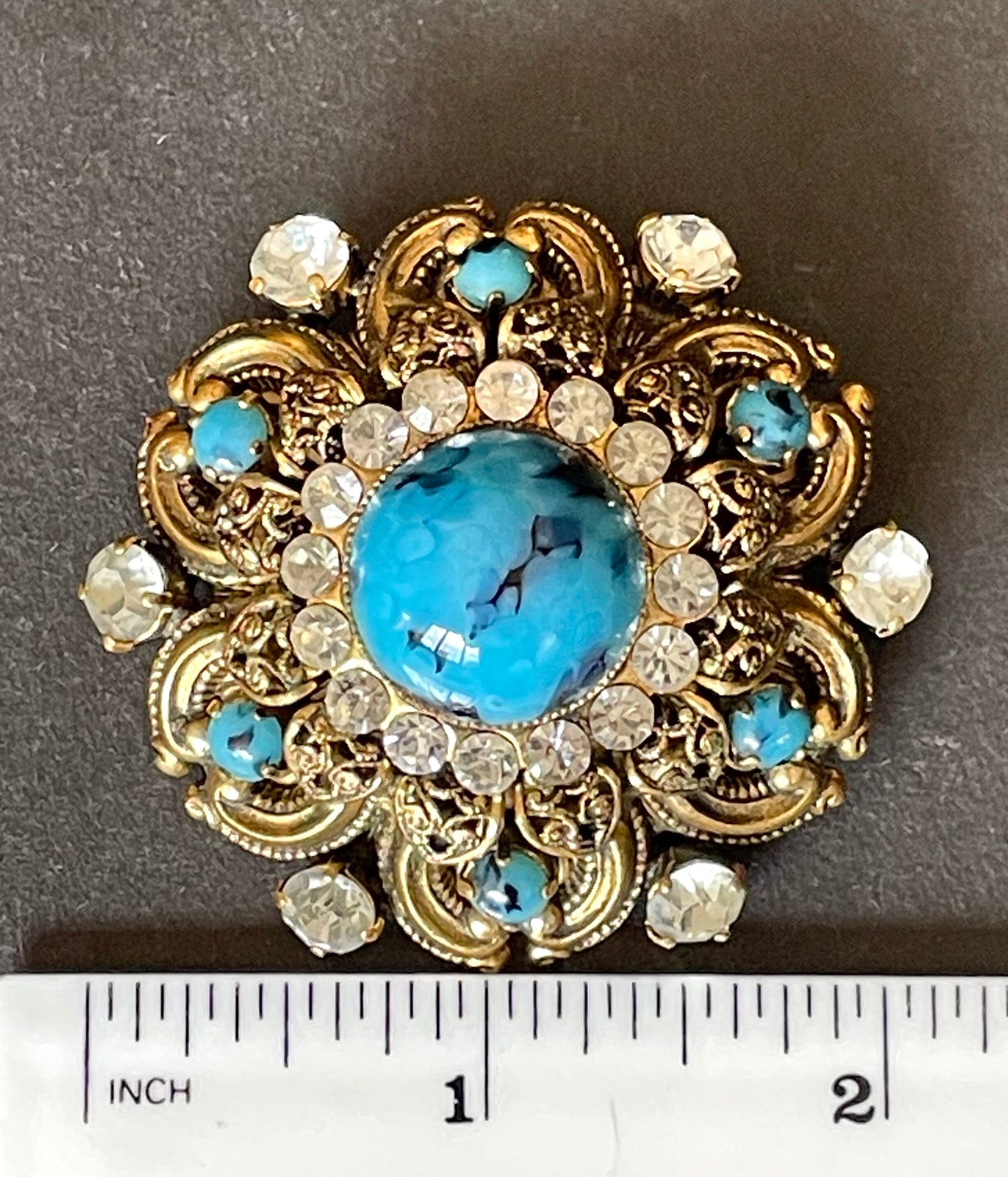 Large vintage Art Deco faux turquoise glass cabochon, clear paste rhinestone and gold tone filigree Czech flower brooch, Max Neiger style