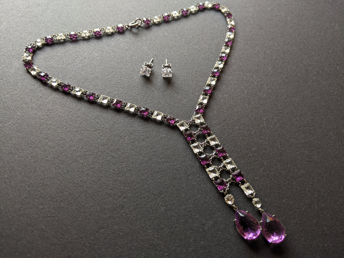 Vintage Art Deco clear & amethyst purple paste silver tone riviere negligee necklace with open backed bezel set square rhinestones