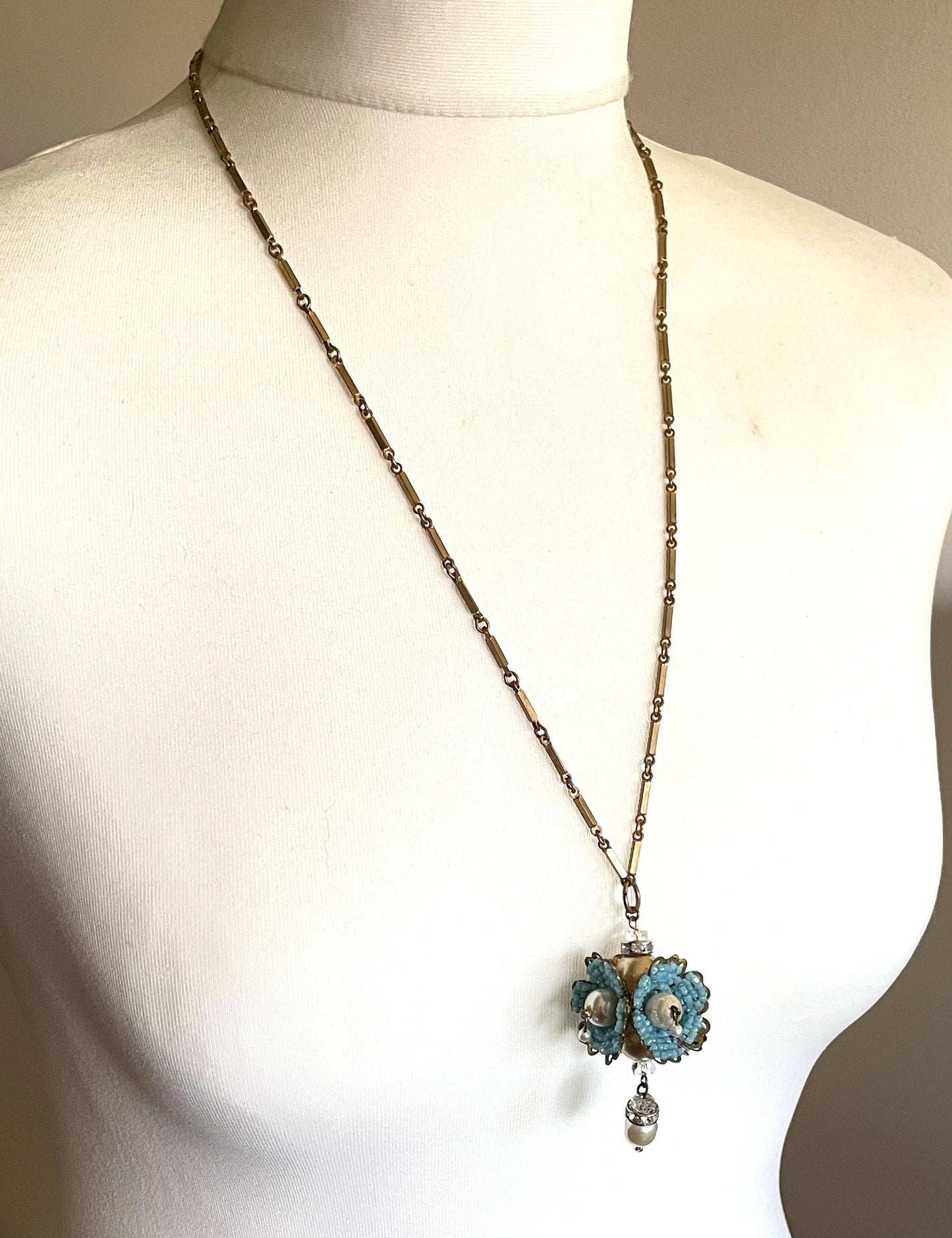 Vintage Miriam Haskell elaborate glass beaded floral  long pendant necklace with intricate turquoise blue micro beading and white faux pearl