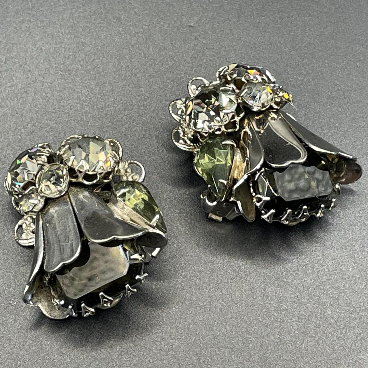 Vintage large rhinestone tulip flower design clip on earrings, silver tone with grey / green rhinestones and filigree backs