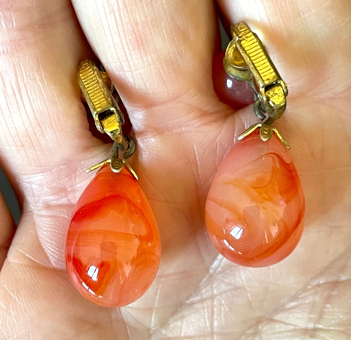 Vintage Art Deco large teardrop glass faux carnelian and gold tone statement clip on earrings, stamped ges gescht