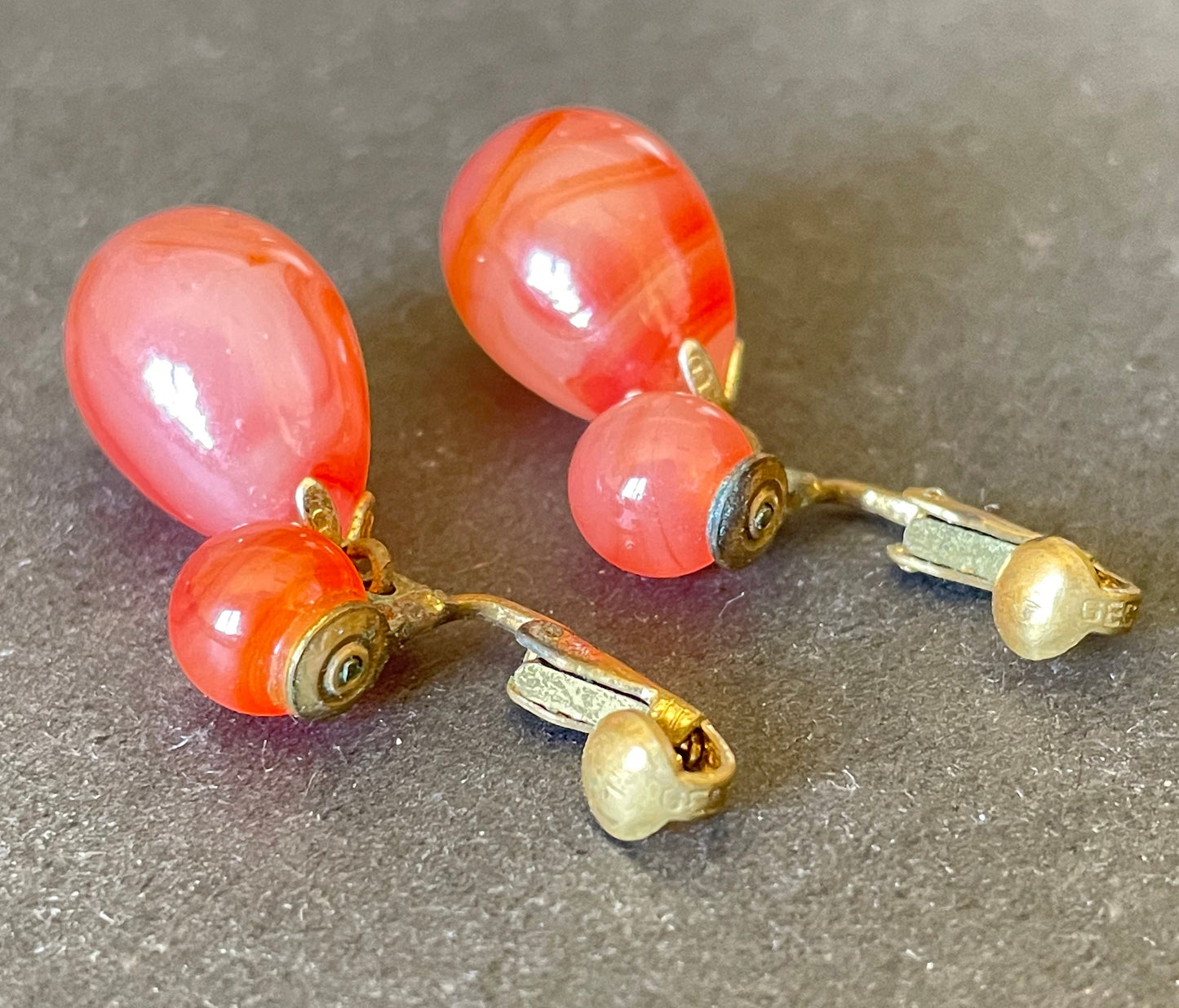 Vintage Art Deco large teardrop glass faux carnelian and gold tone statement clip on earrings, stamped ges gescht