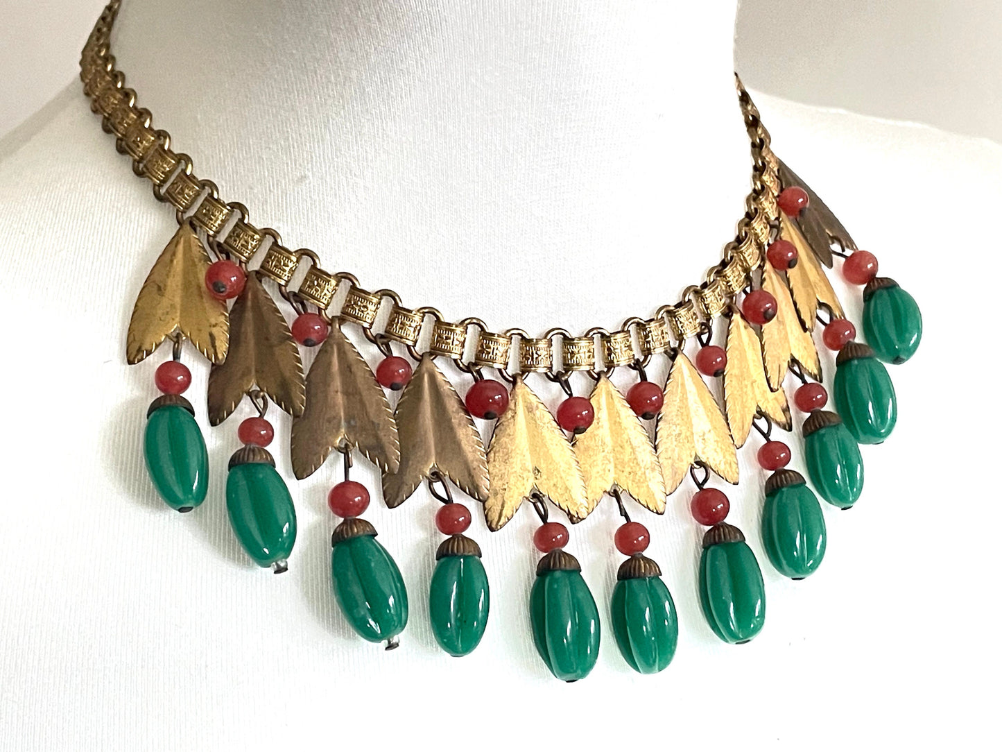 Vintage early Miriam Haskell jade green and orange poured glass beaded and gold tone Egyptian revival fringe necklace with book chain links