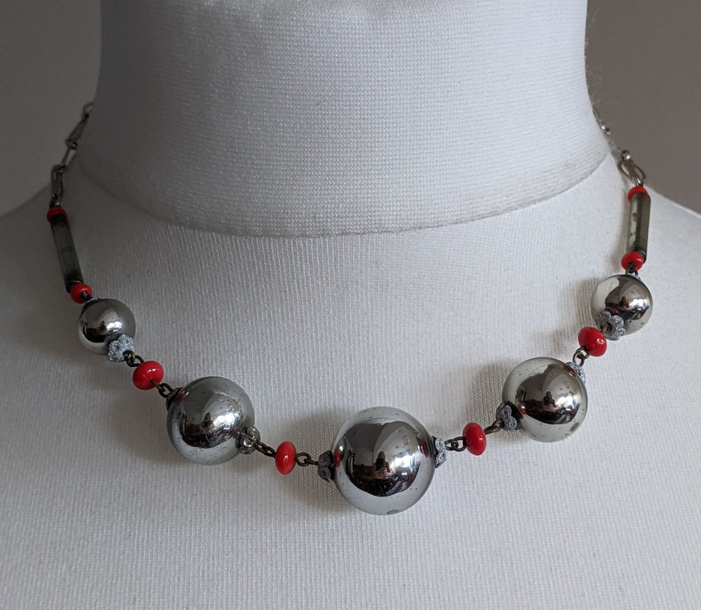 Vintage Art Deco silvered hollow blown glass beads and chrome machine age necklace with red glass accent beads