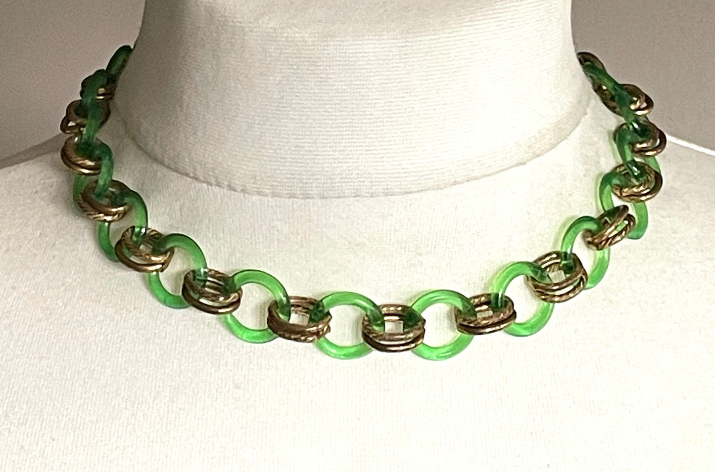 Vintage Jakob Bengel Art Deco 1930s machine age collar necklace with early plastic transparent green circles, antique gold tone links