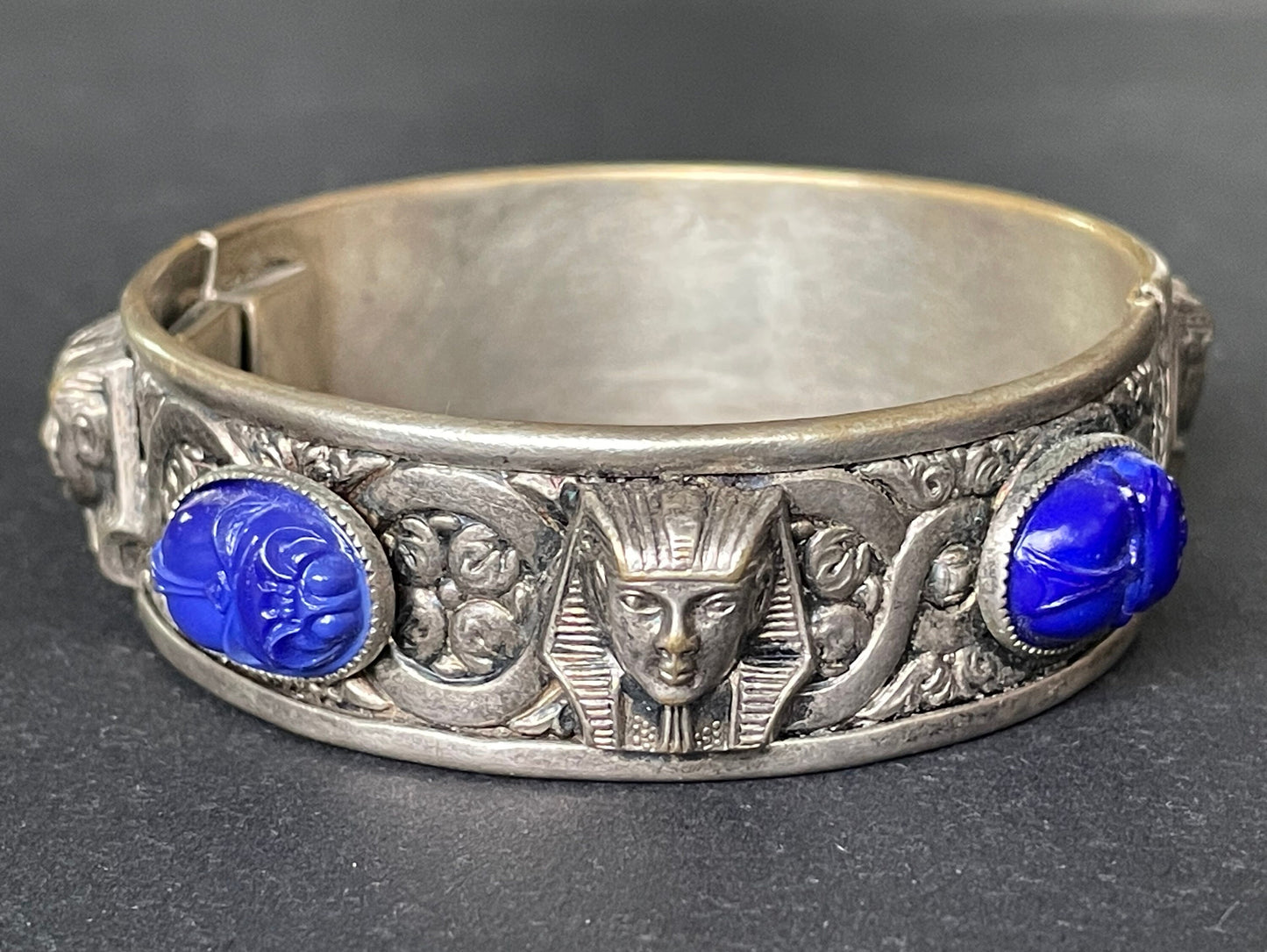 Vintage Egyptian revival Tutankhamun pharaoh and scarab beetle silver tone bangle, blue glass (faux lapis lazuli) scarab cabochons, Czech ?