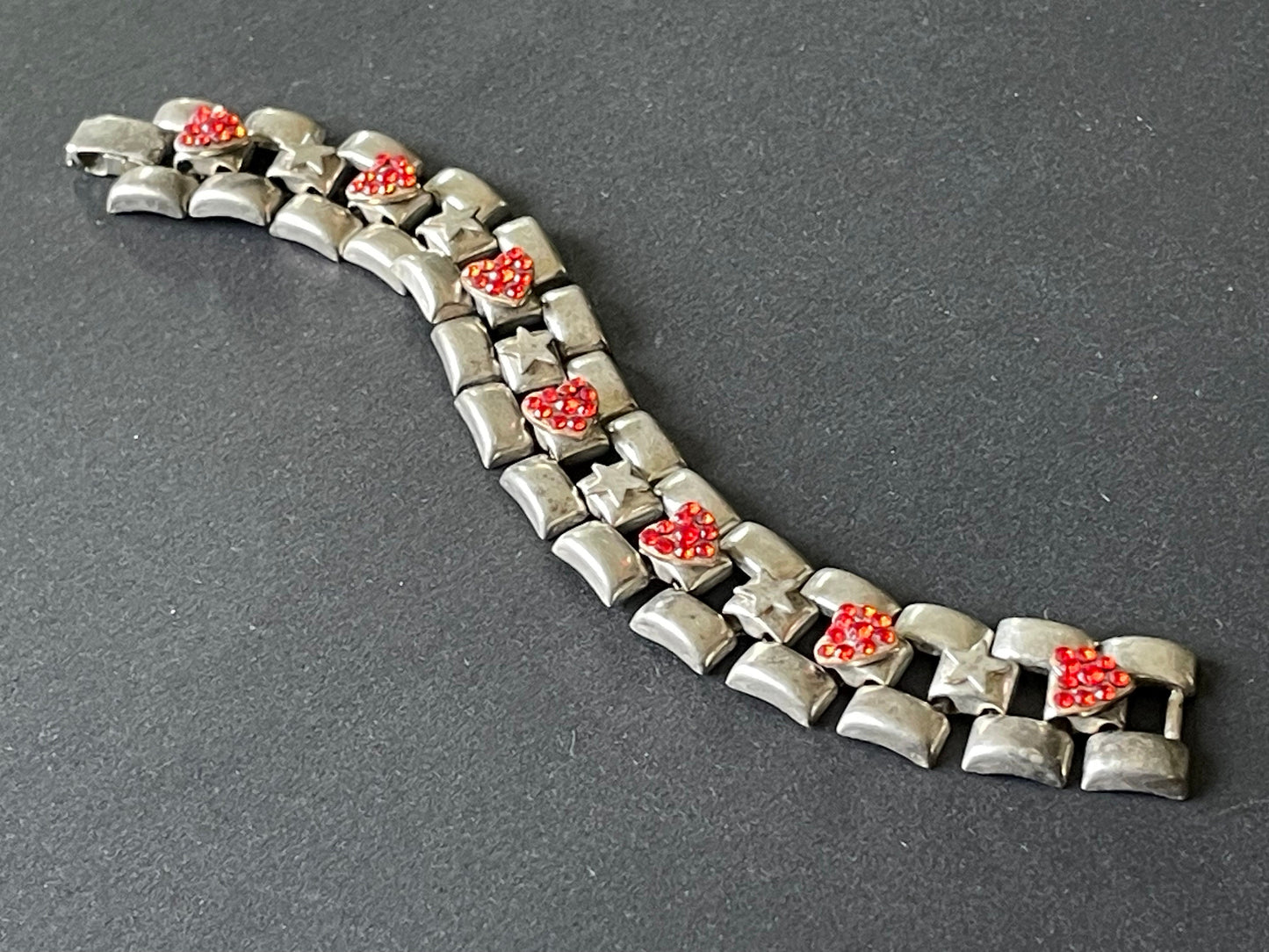 Vintage signed Askew London red rhinestone heart and star tank track panel bracelet in antique silver tone