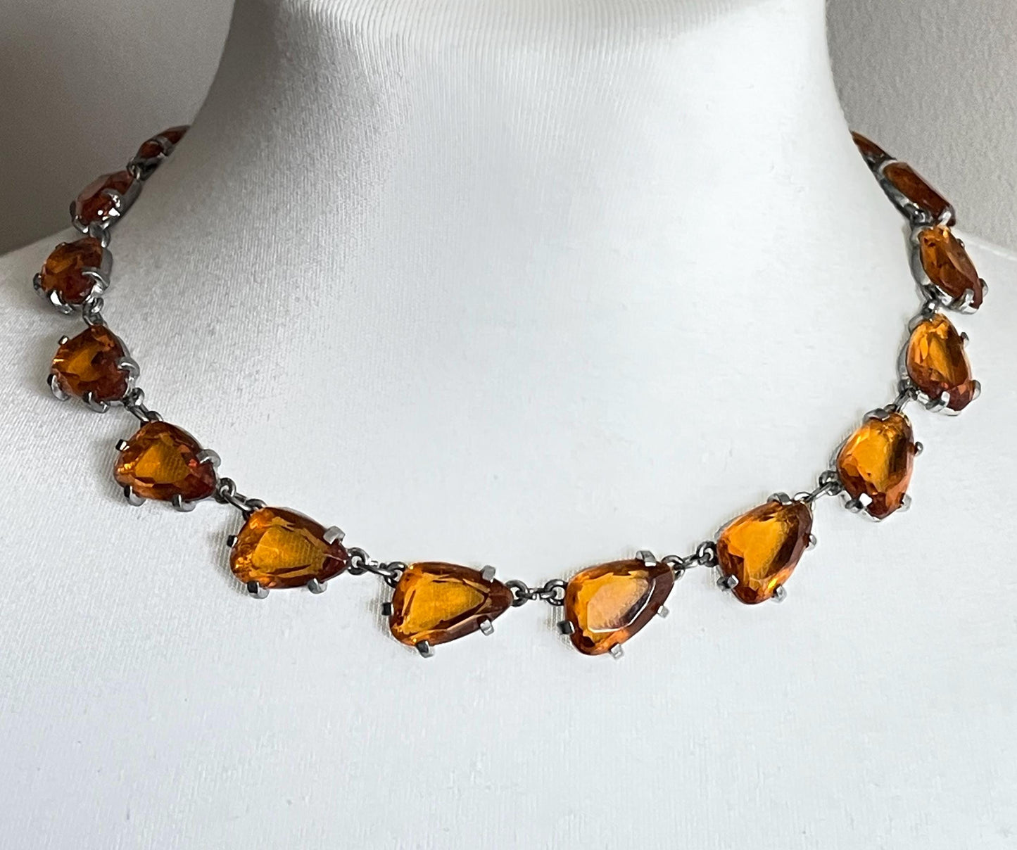 Vintage signed Sphinx citrine yellow / topaz orange glass riviere necklace, triangle shaped crystals set open-backed in silver tone settings