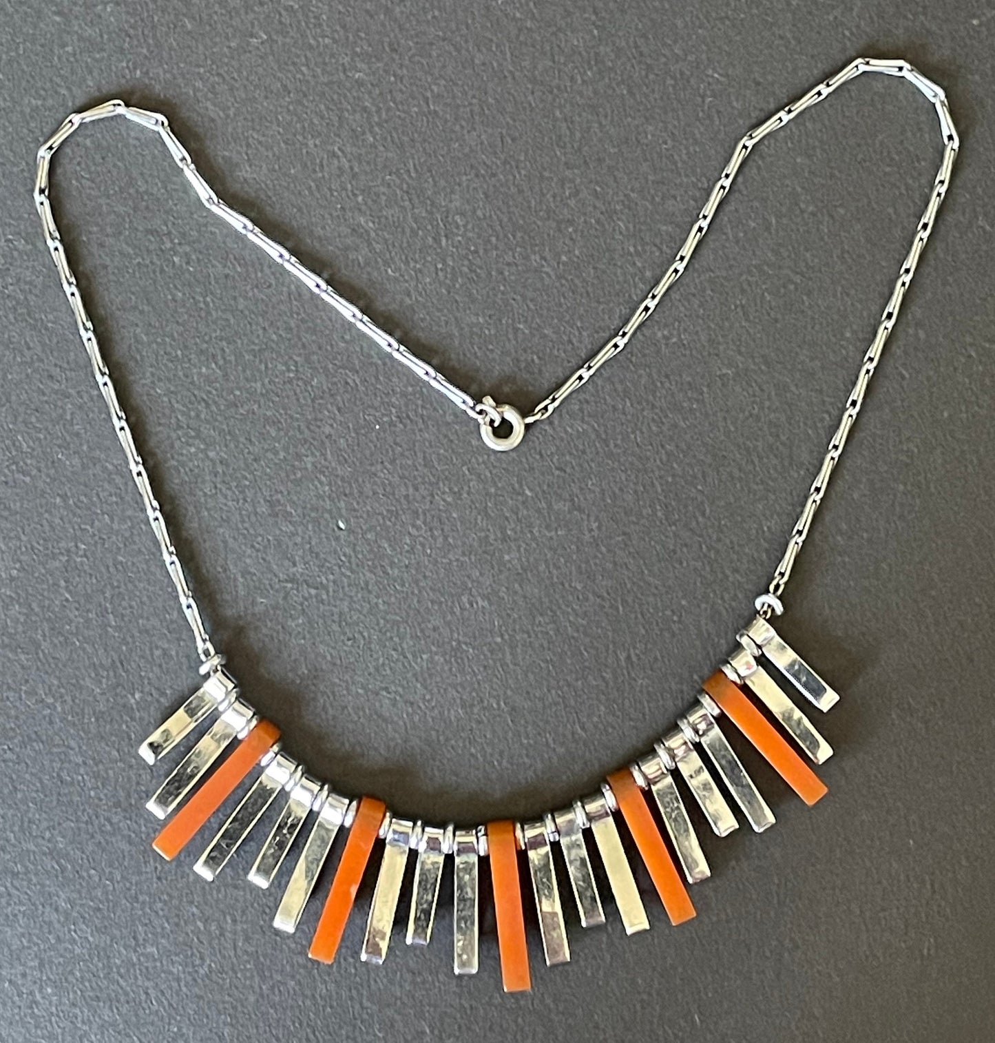 Vintage Jakob Bengel Art Deco machine age necklace, beautiful bright orange galalith 3D geometric shapes with shiny silver tone chrome