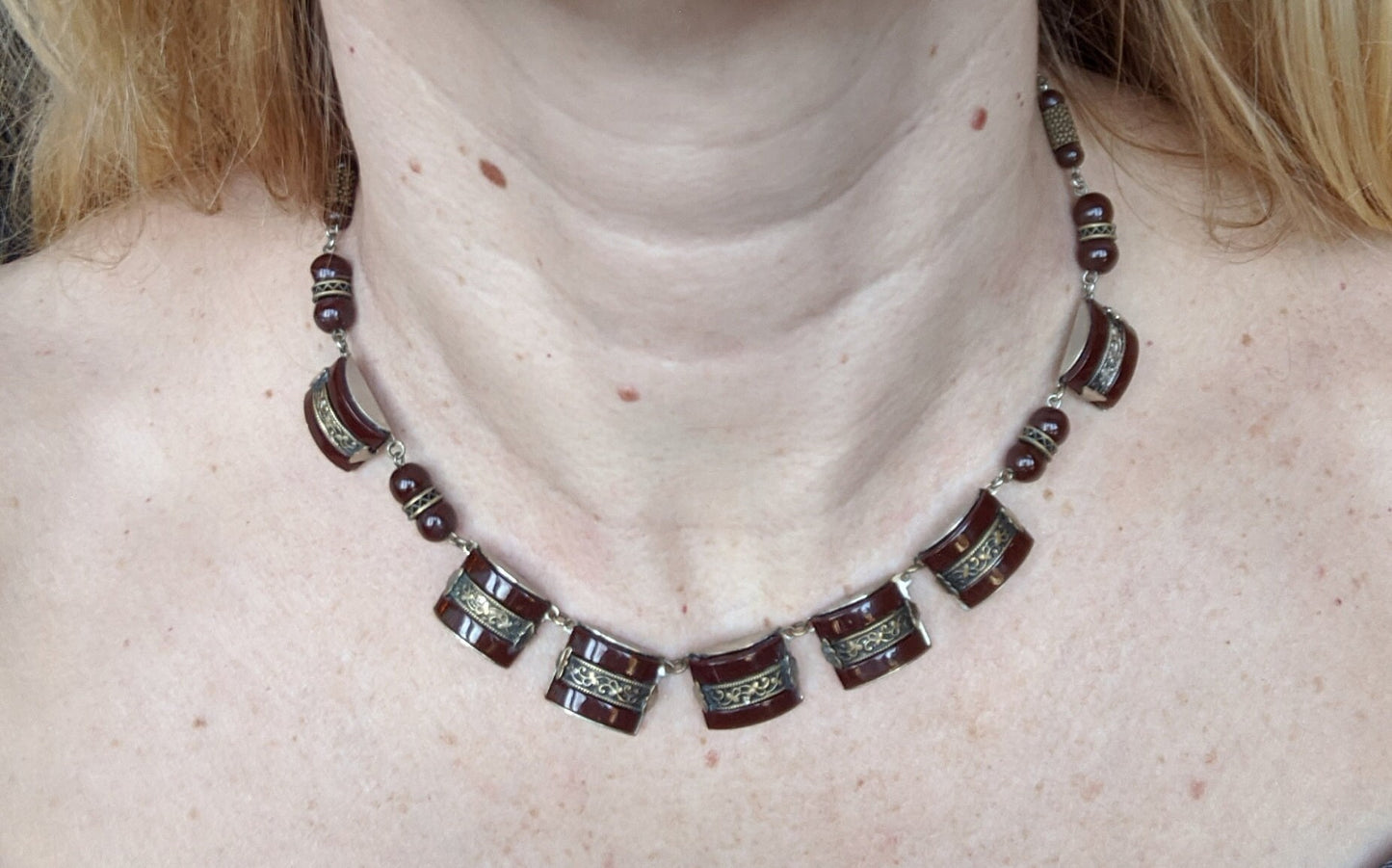 Vintage Art Deco machine age chrome, burgundy / brown glass geometric necklace with filigree detail