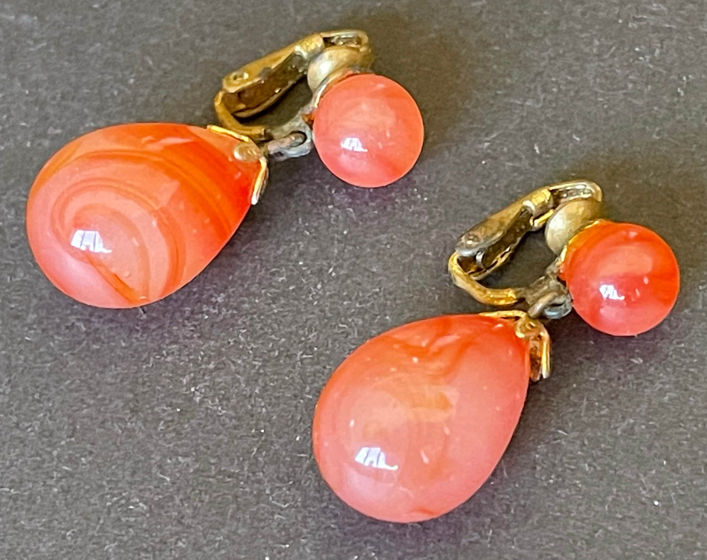 Vintage Art Deco large teardrop glass faux carnelian and gold tone statement clip on earrings, stamped ges gescht