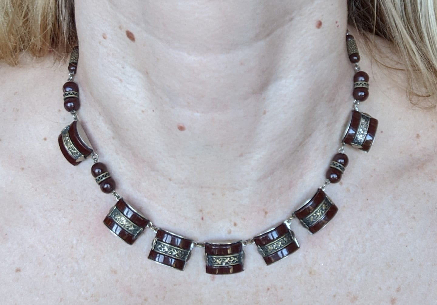 Vintage Art Deco machine age chrome, burgundy / brown glass geometric necklace with filigree detail