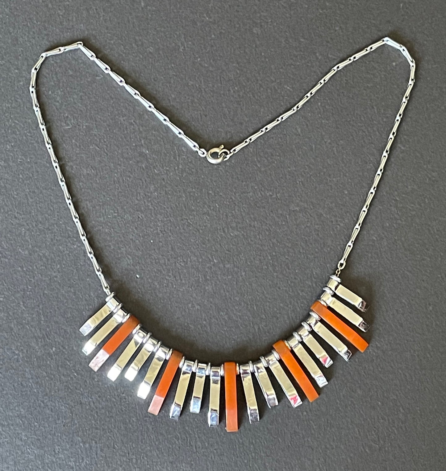 Vintage Jakob Bengel Art Deco machine age necklace, beautiful bright orange galalith 3D geometric shapes with shiny silver tone chrome