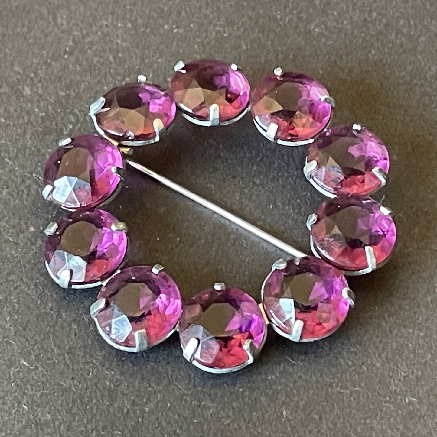 Vintage Art Deco bezel set gorgeous vibrant amethyst purple crystal riviere circle brooch, open-backed rhinestones in silver tone