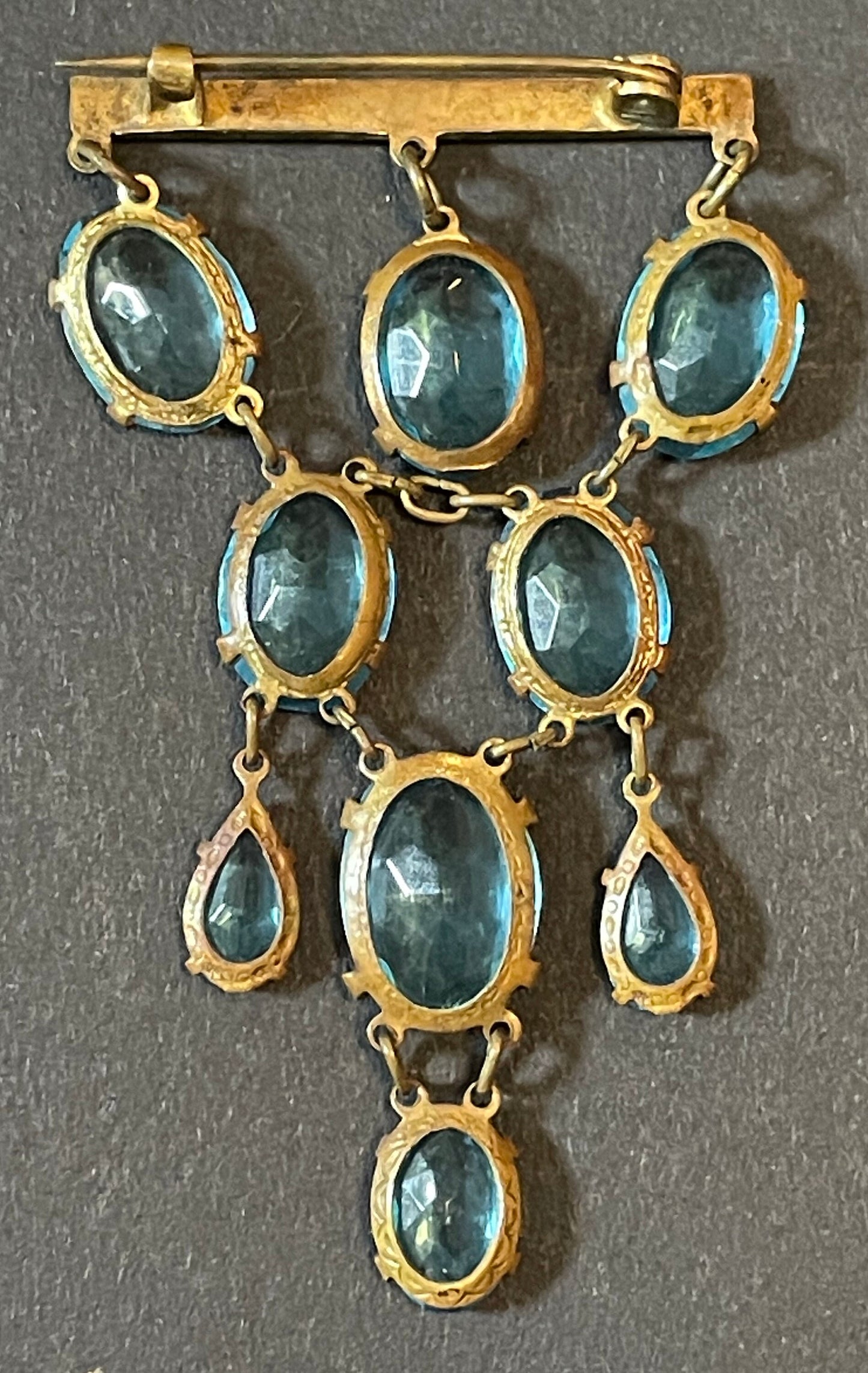 Vintage Art Deco aqua blue paste festoon dangle brooch with bezel set, open backed aquamarine coloured crystals set in antique gold tone