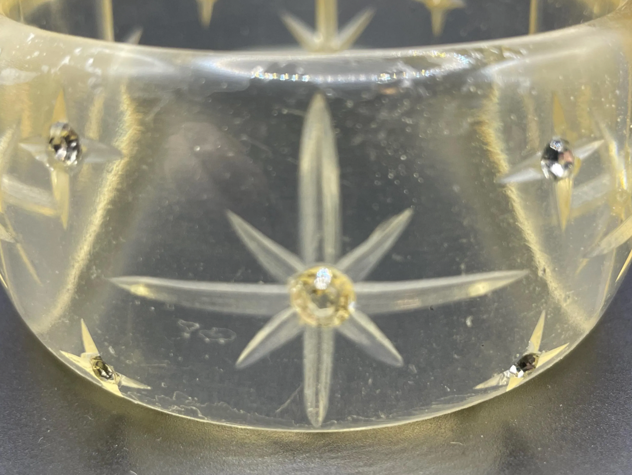 Vintage apple juice coloured transparent plastic wide, engraved bangle, studded with clear glass rhinestones, Art Deco style