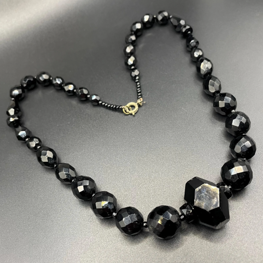 Vintage Art Deco black French jet glass faceted bead necklace with pretty beads in different shapes and sizes