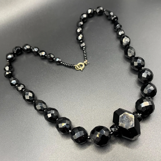 Vintage Art Deco black French jet glass faceted bead necklace with pretty beads in different shapes and sizes