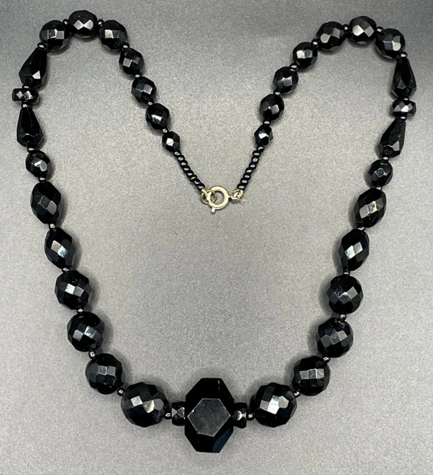 Vintage Art Deco black French jet glass faceted bead necklace with pretty beads in different shapes and sizes