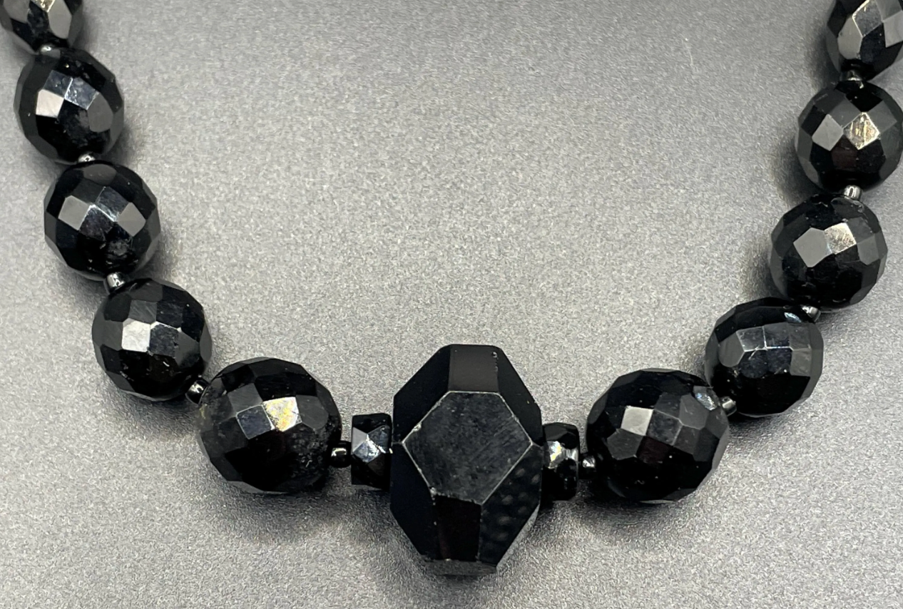 Vintage Art Deco black French jet glass faceted bead necklace with pretty beads in different shapes and sizes
