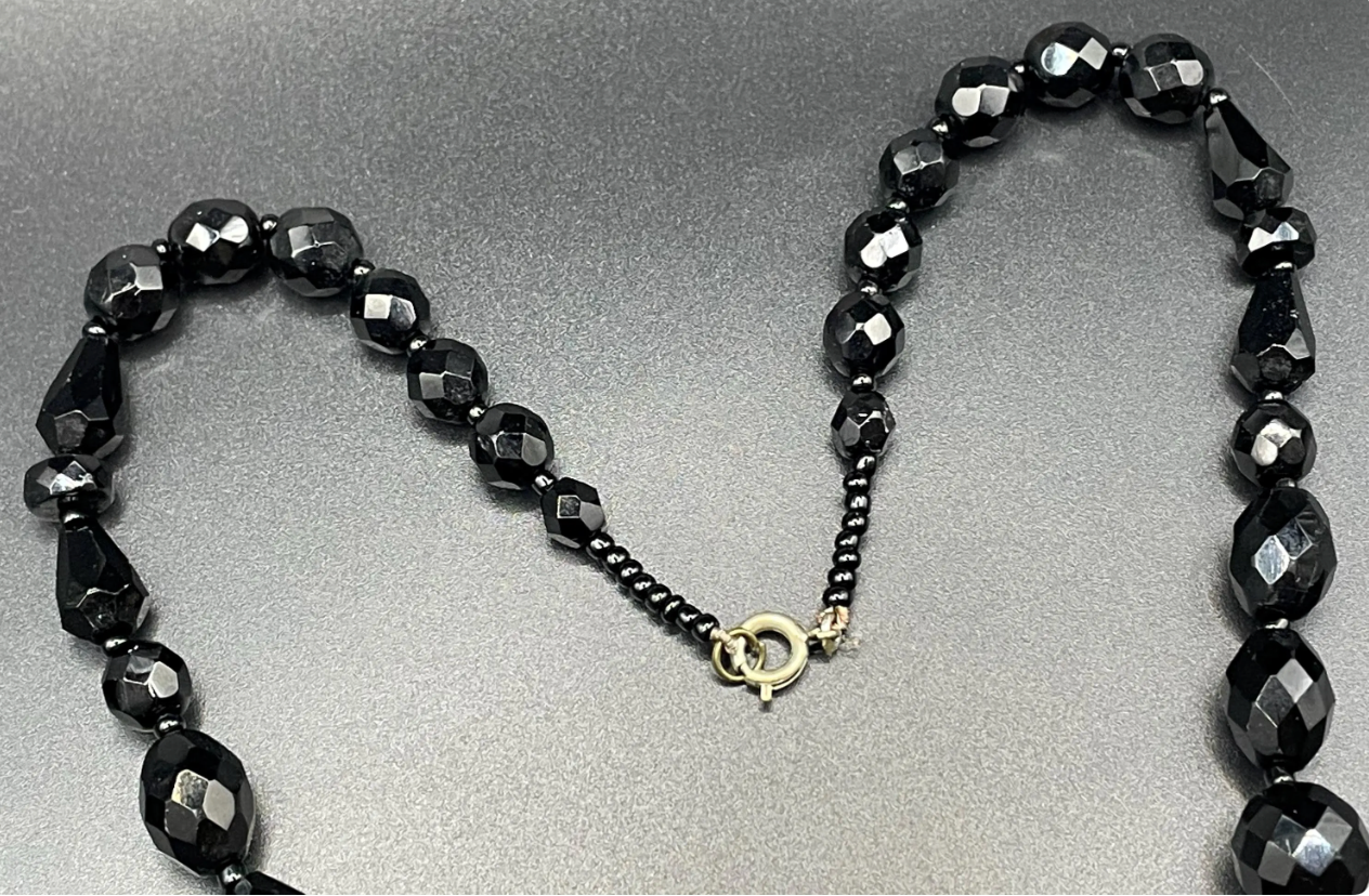 Vintage Art Deco black French jet glass faceted bead necklace with pretty beads in different shapes and sizes