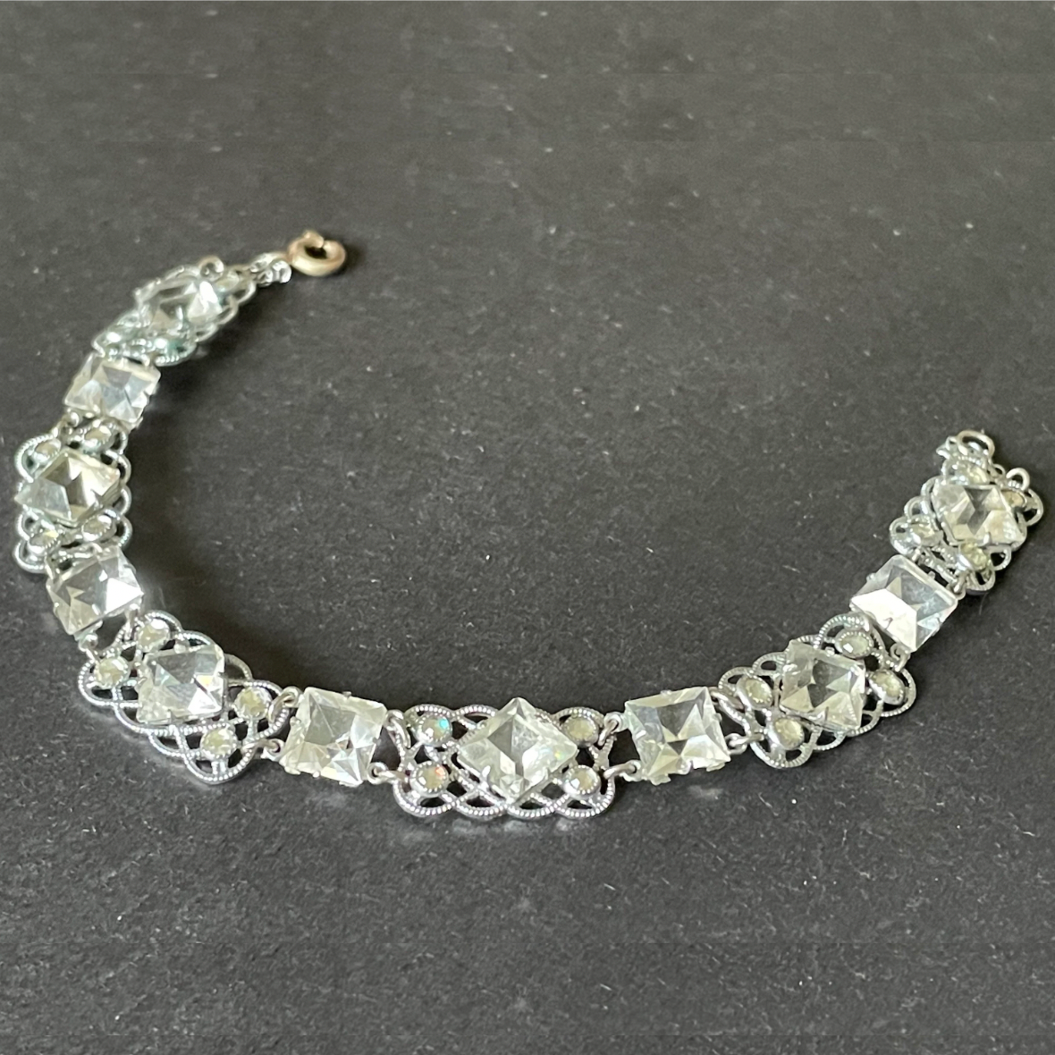 Vintage bracelet, Art Deco paste rhinestone and open backed princess cut crystal geometric silver tone filigree cocktail bracelet