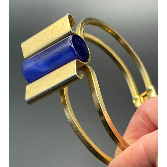 Vintage Jakob Bengel Art Deco machine age clamper bangle in shiny gold tone with a rich blue galalith cylinder