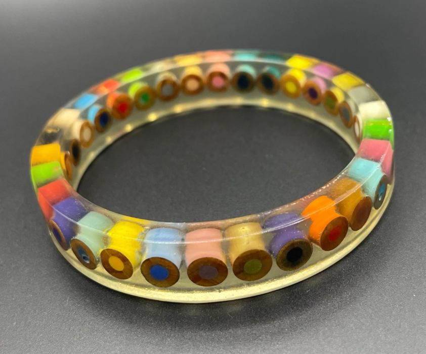 Vintage clear /apple juice tinted plastic / resin inclusion bangle enclosing slices of colouring pencils, multicoloured, handmade