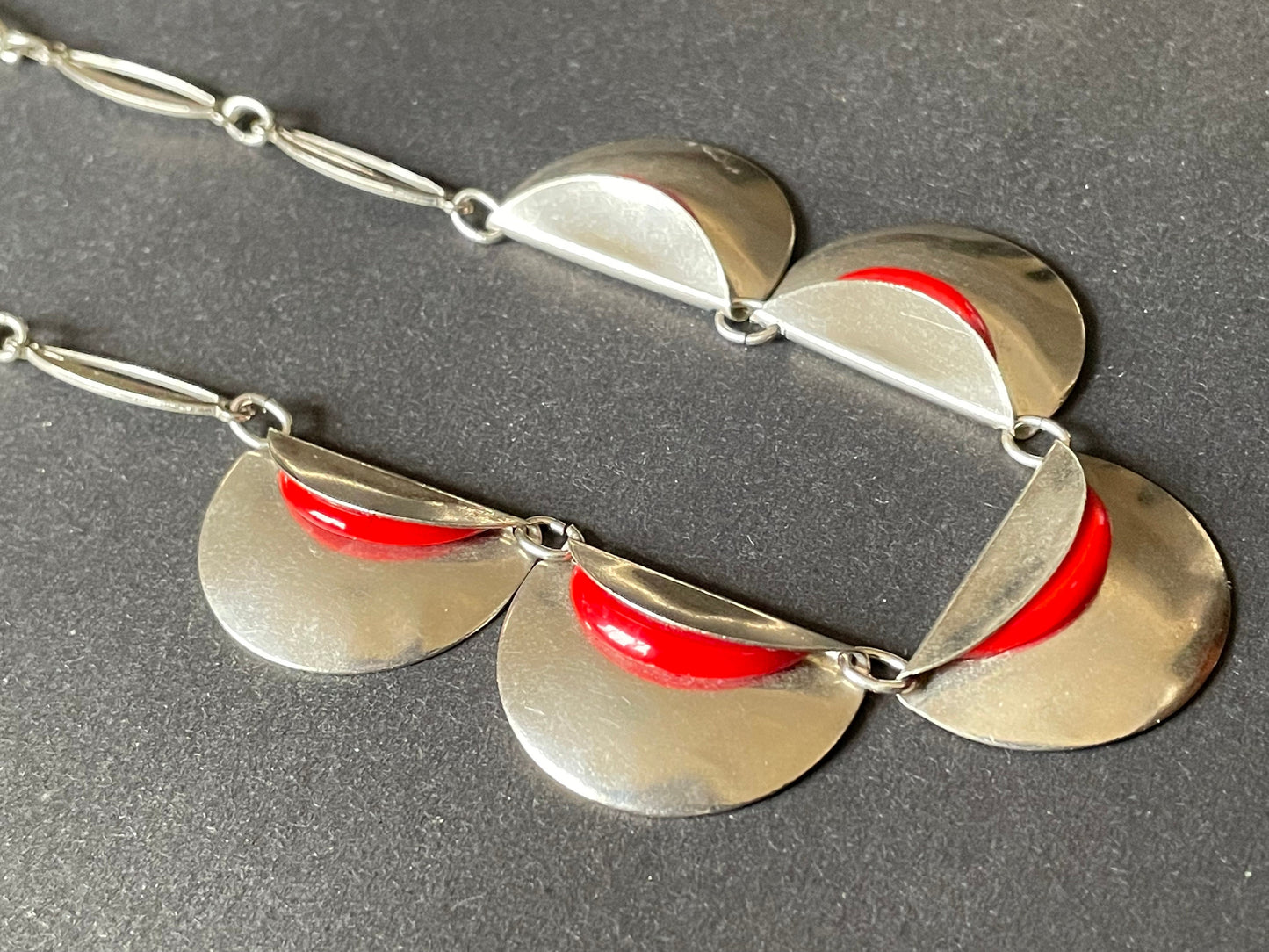 Vintage Jakob Bengel Art Deco machine age necklace, bright red galalith geometric shapes with shiny silver tone chrome folded discs