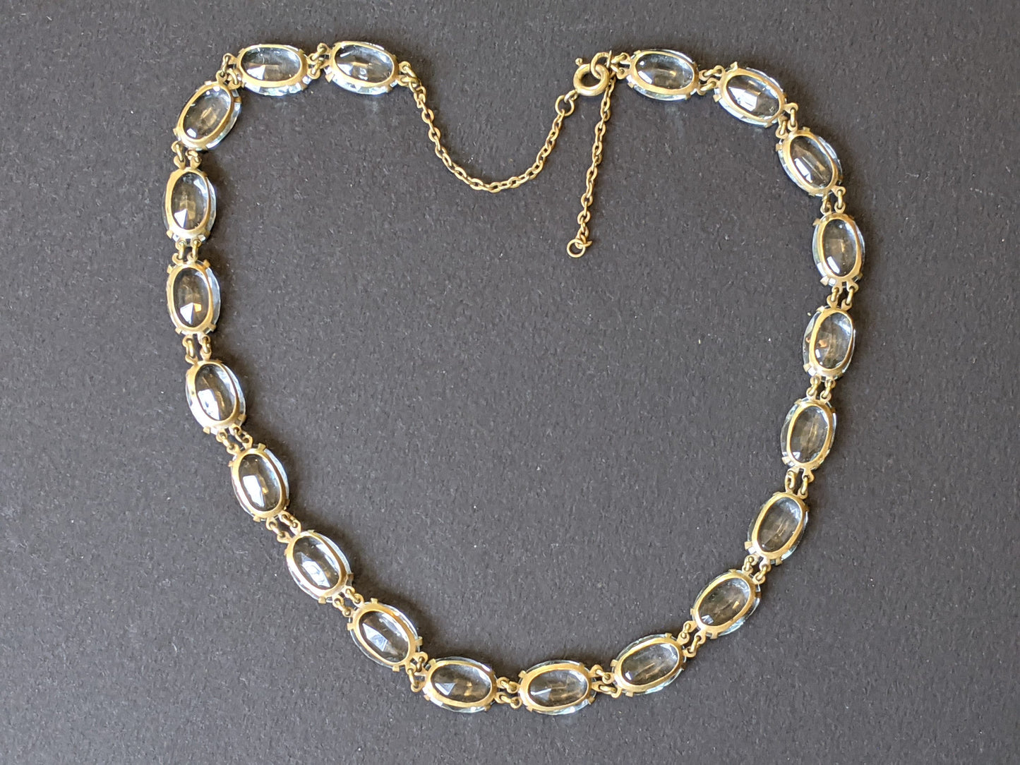 Vintage Art Deco clear paste large oval crystal riviere necklace, bezel set open backed Czech crystal stones set in gold tone