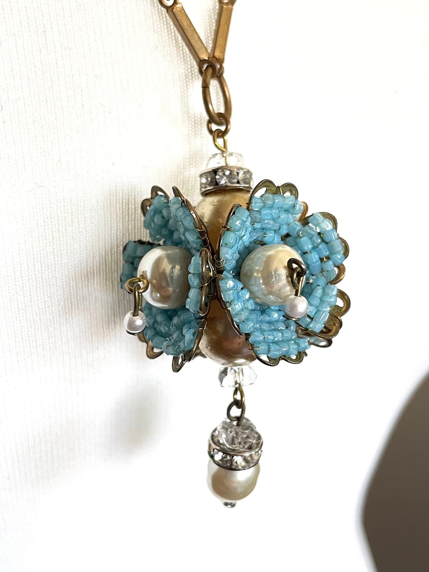 Vintage Miriam Haskell elaborate glass beaded floral  long pendant necklace with intricate turquoise blue micro beading and white faux pearl