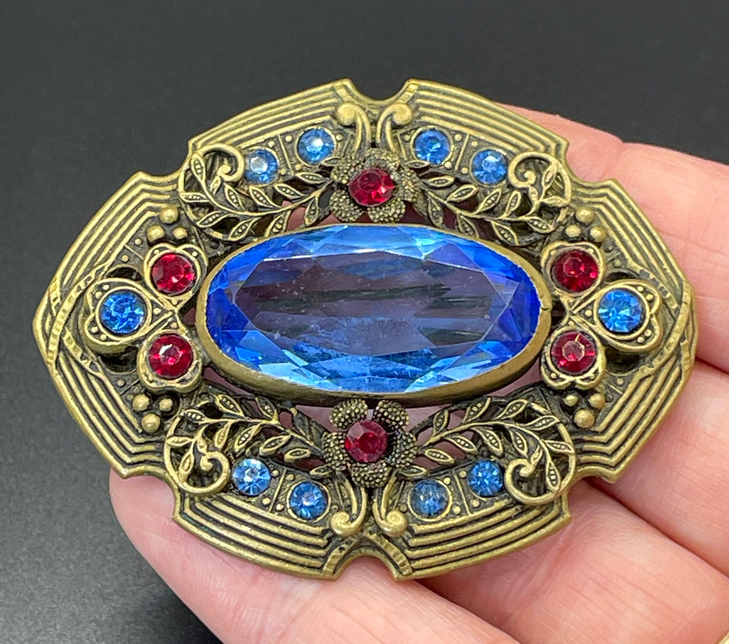 Large vintage Art Deco sapphire blue and bright ruby red rhinestone and ornate gold tone floral design Czech brooch, Neiger style