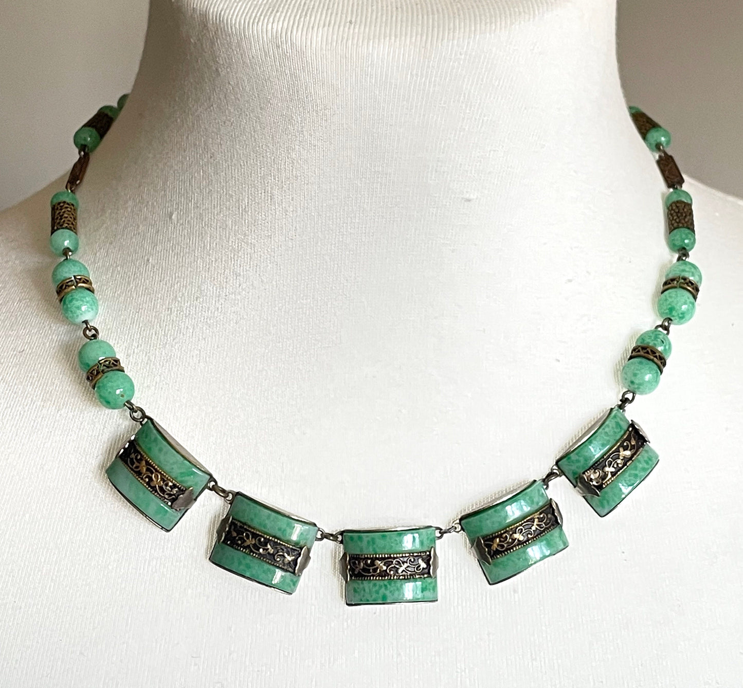 Vintage Art Deco machine age chrome silver tone and brass gold tone, green 'Peking' style glass necklace and screw back earrings set