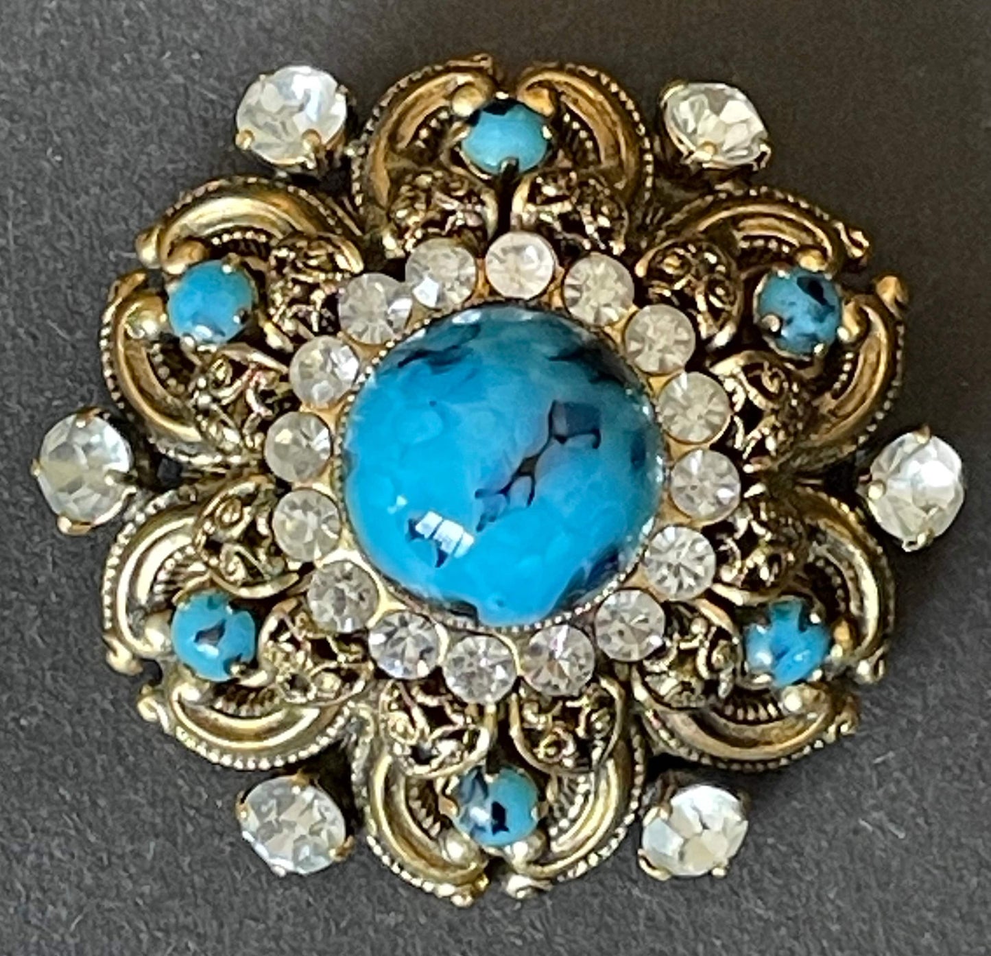 Large vintage Art Deco faux turquoise glass cabochon, clear paste rhinestone and gold tone filigree Czech flower brooch, Max Neiger style