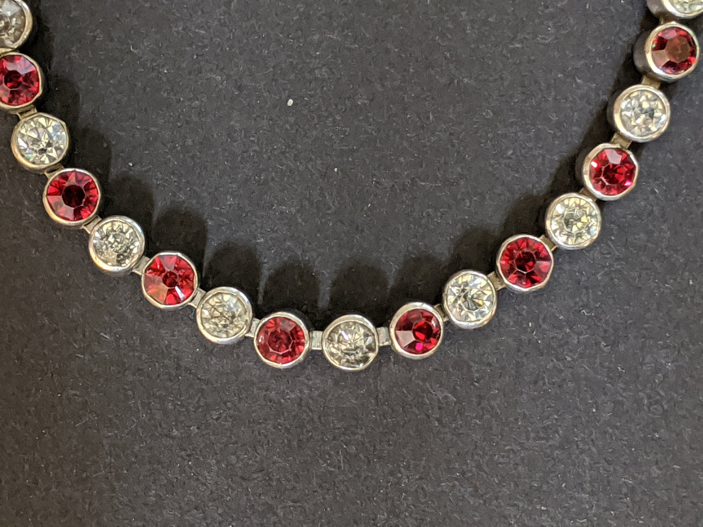 Vintage 1930s Art Deco collet set bright ruby red and clear rhinestone and silver tone tennis / cocktail bracelet