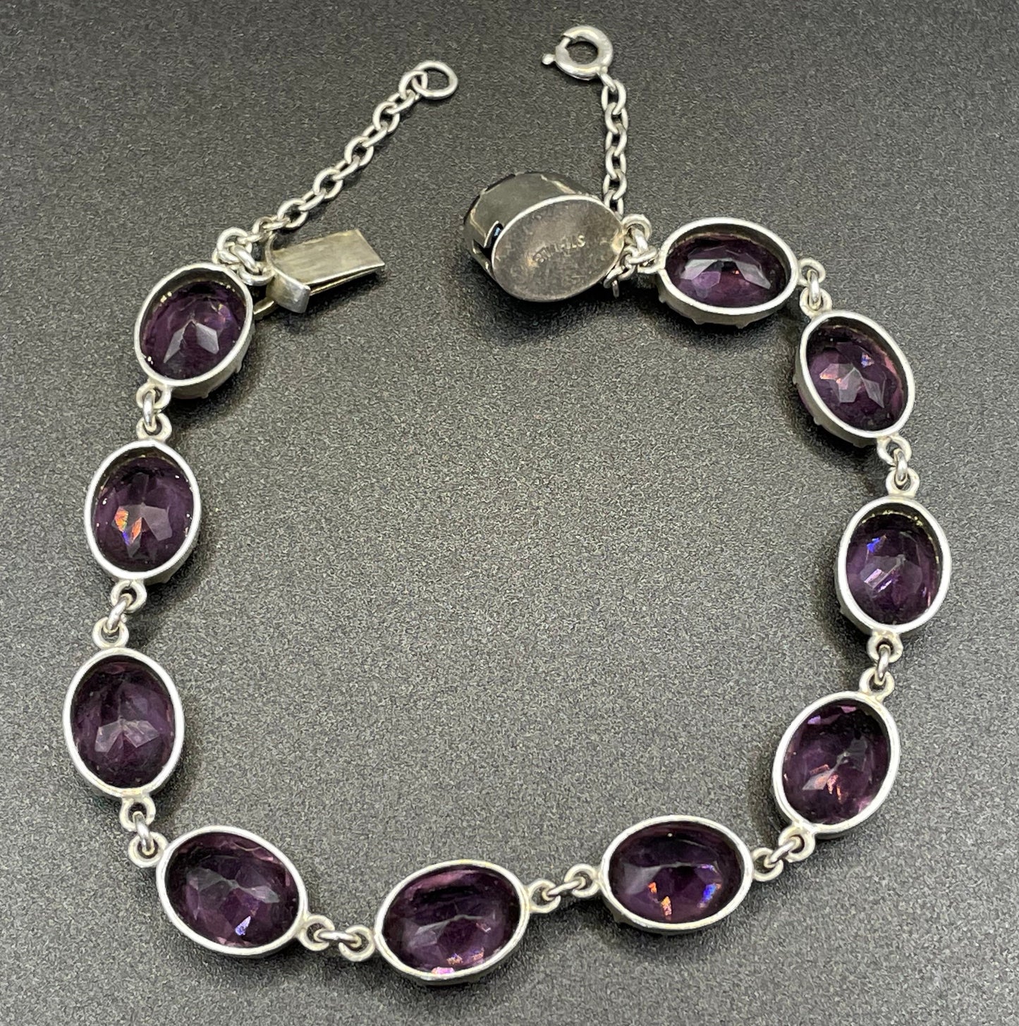 Antique fine sterling silver and amethyst paste collet set riviere style bracelet, bezel set, open backed large, oval purple stones, in box