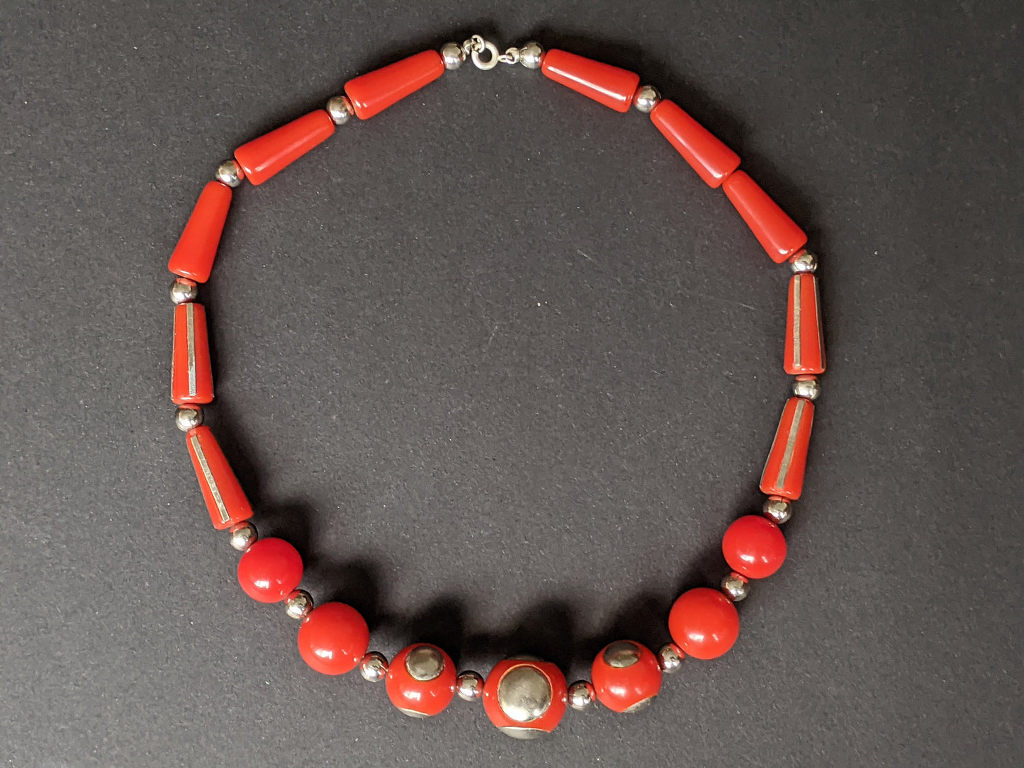 Vintage Art Deco machine age silver tone inset and large bright brick red early plastic, possibly galalith, bead chunky statement necklace