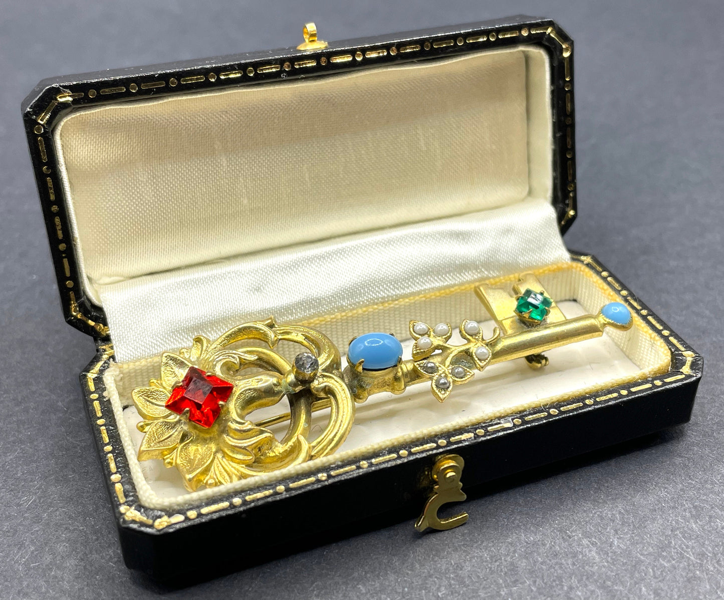 Vintage key brooch, gold tone, white and black glass pearls, red and green rhinestones and turquoise glass cabochons, old presentation box