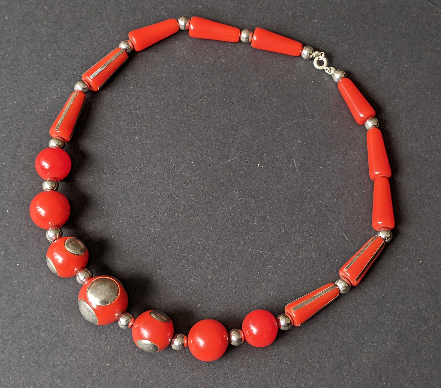 Vintage Art Deco machine age silver tone inset and large bright brick red early plastic, possibly galalith, bead chunky statement necklace