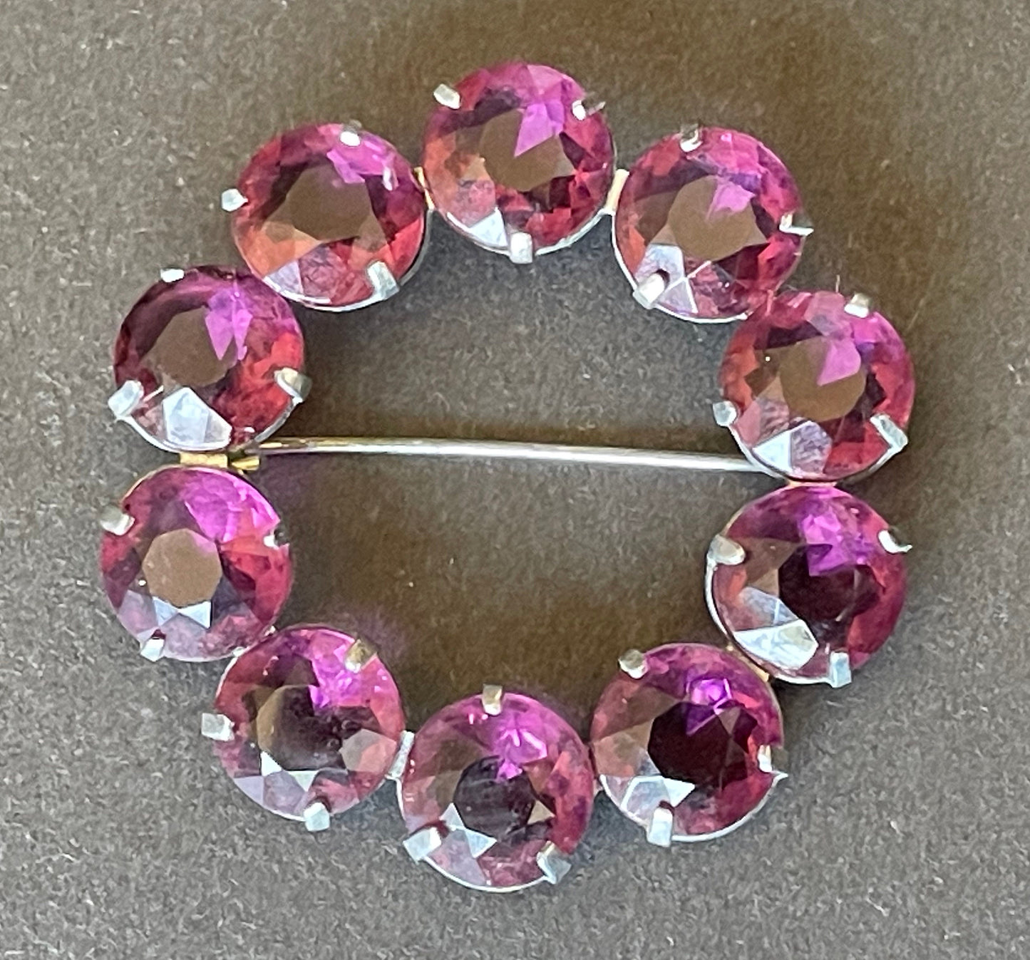 Vintage Art Deco bezel set gorgeous vibrant amethyst purple crystal riviere circle brooch, open-backed rhinestones in silver tone