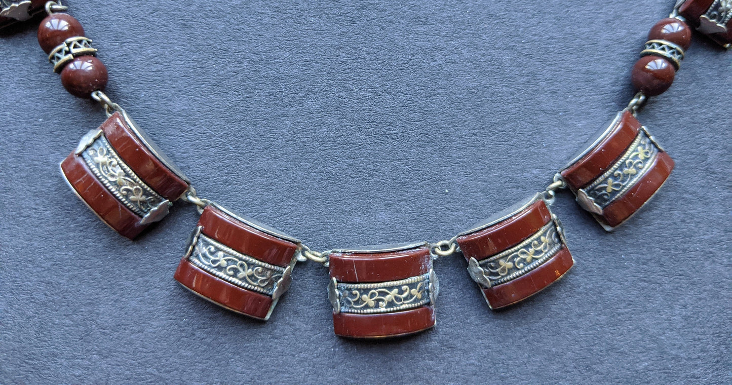 Vintage Art Deco machine age chrome, burgundy / brown glass geometric necklace with filigree detail