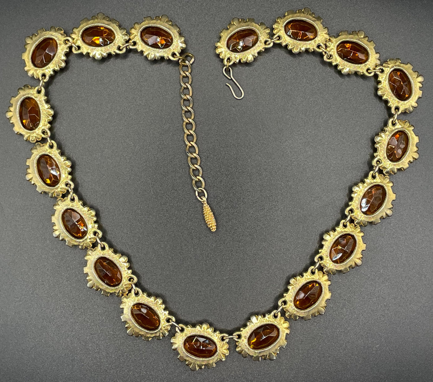 Vintage bright orange topaz / citrine yellow riviere necklace, made by Sphinx, bezel set, open-backed stones in ornate gold tone setting