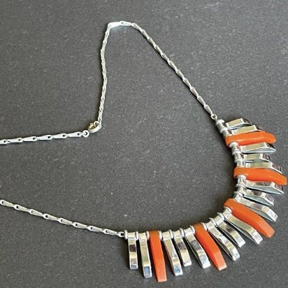 Vintage Jakob Bengel Art Deco machine age necklace, beautiful bright orange galalith 3D geometric shapes with shiny silver tone chrome