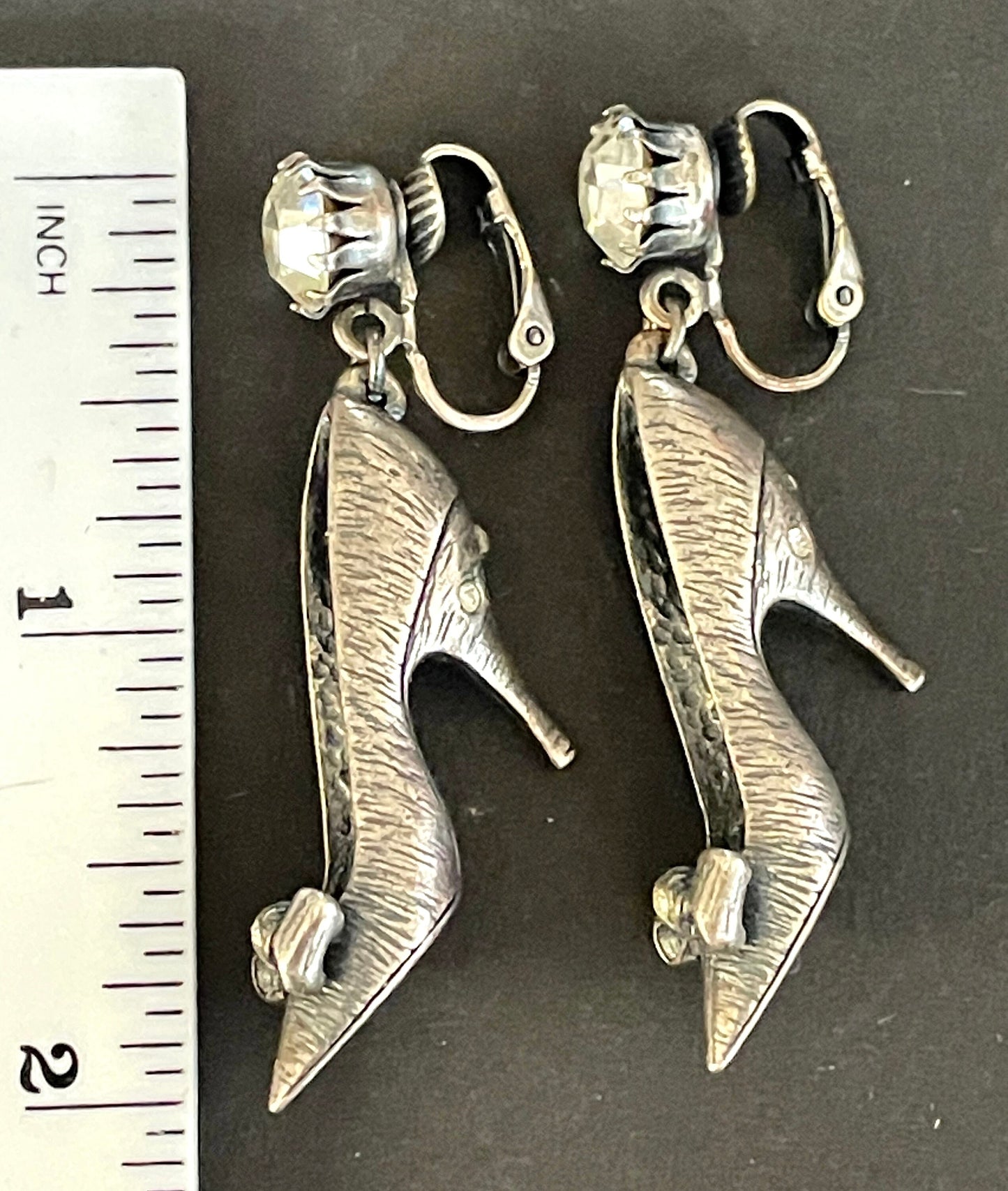 Vintage early Askew London stiletto high heeled shoe statement clip on earrings in chic dark silver tone with clear rhinestones