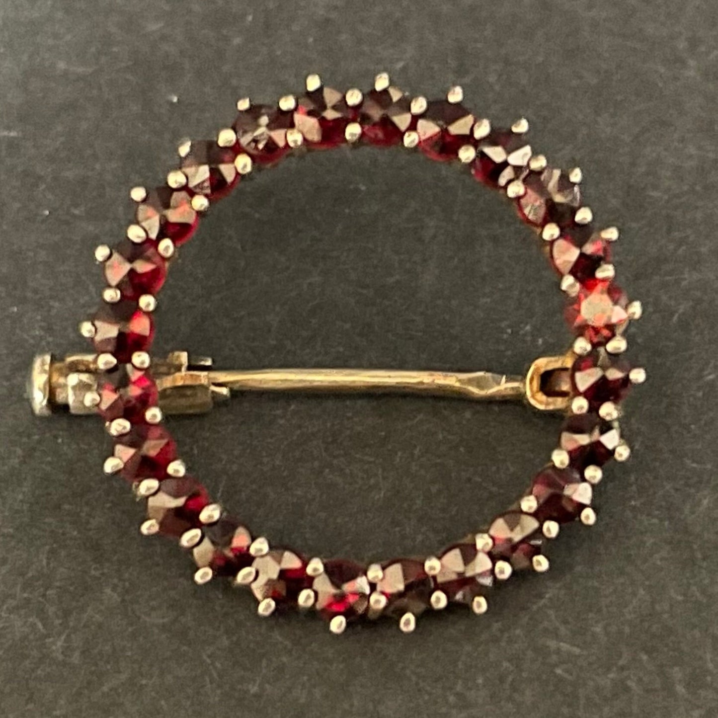 Petite vintage / antique Bohemian garnet circle brooch, rose cut stones set in hallmarked sterling silver gilt, trombone clasp