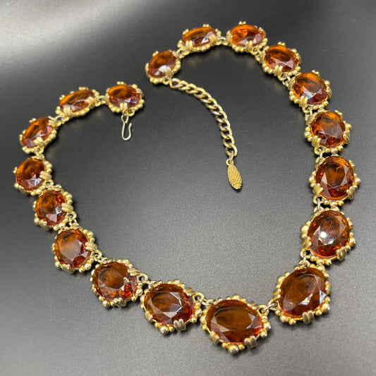 Vintage bright orange topaz / citrine yellow riviere necklace, made by Sphinx, bezel set, open-backed stones in ornate gold tone setting