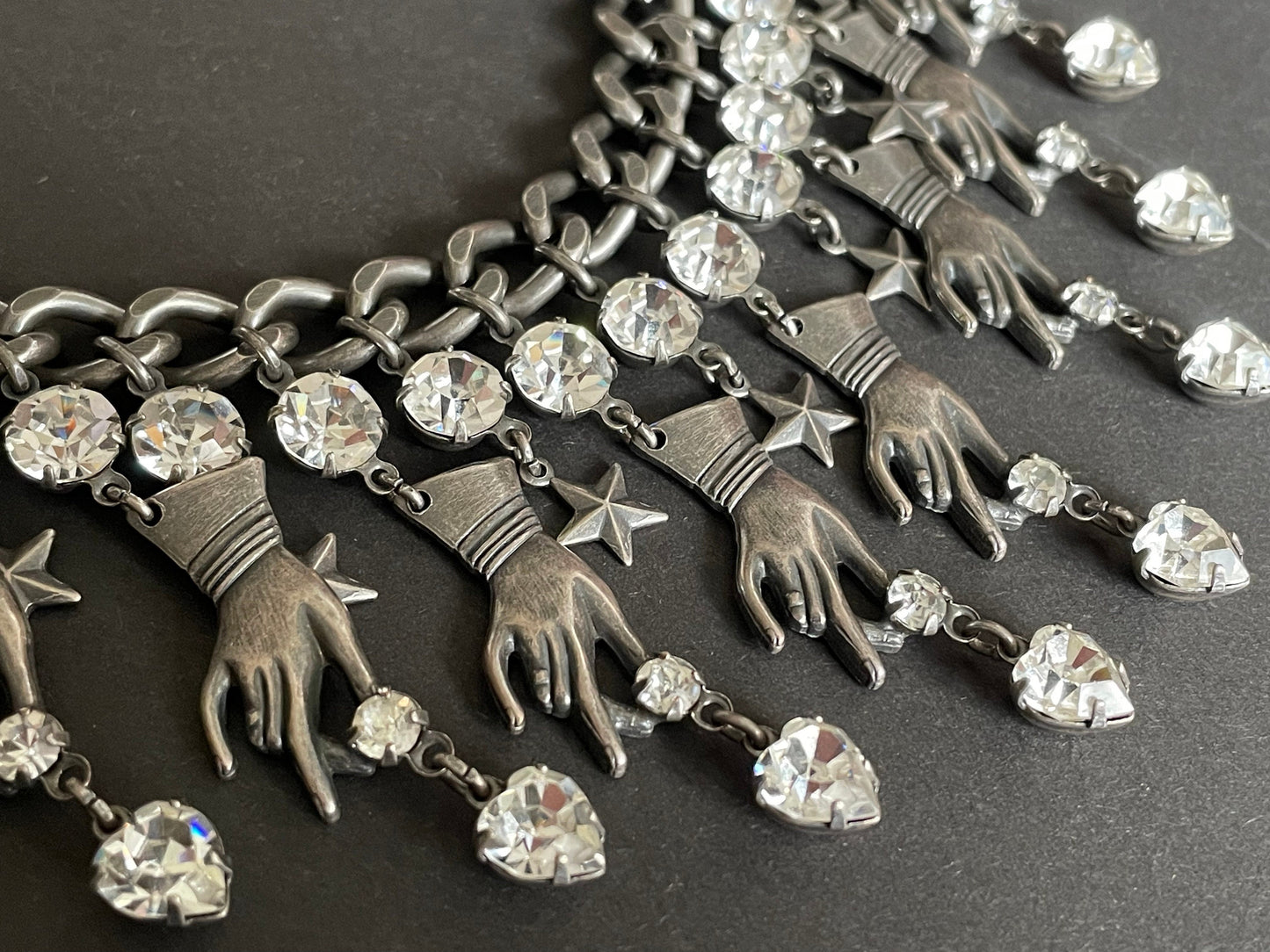 Vintage early Askew London hand, heart and star heavy fringe necklace, statement piece in chic dark silver tone & clear rhinestone, unique