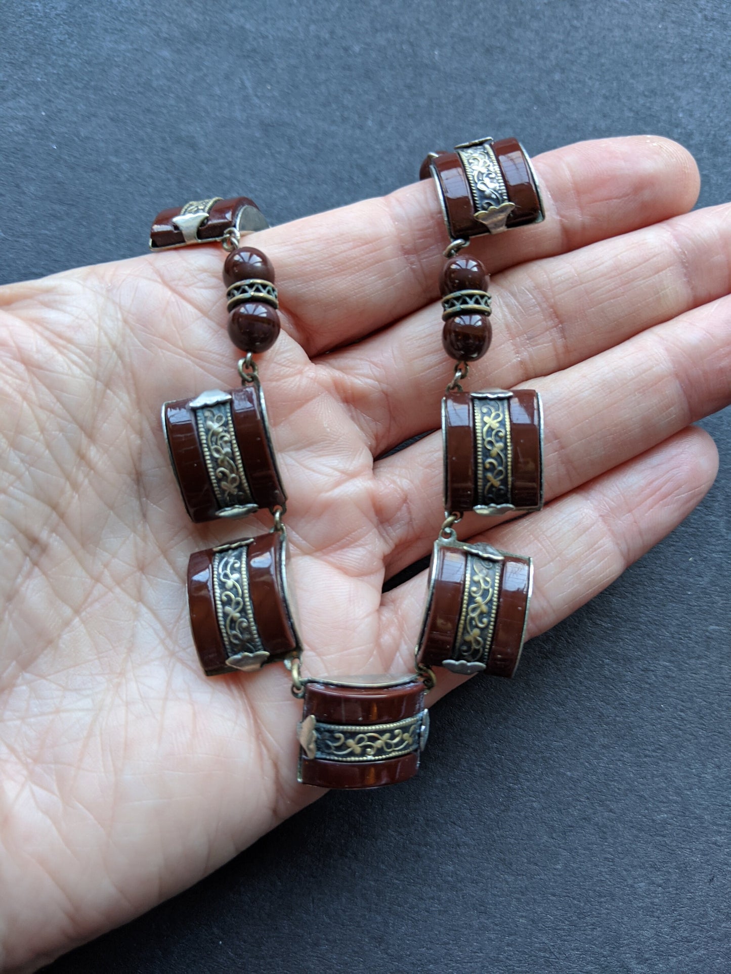 Vintage Art Deco machine age chrome, burgundy / brown glass geometric necklace with filigree detail