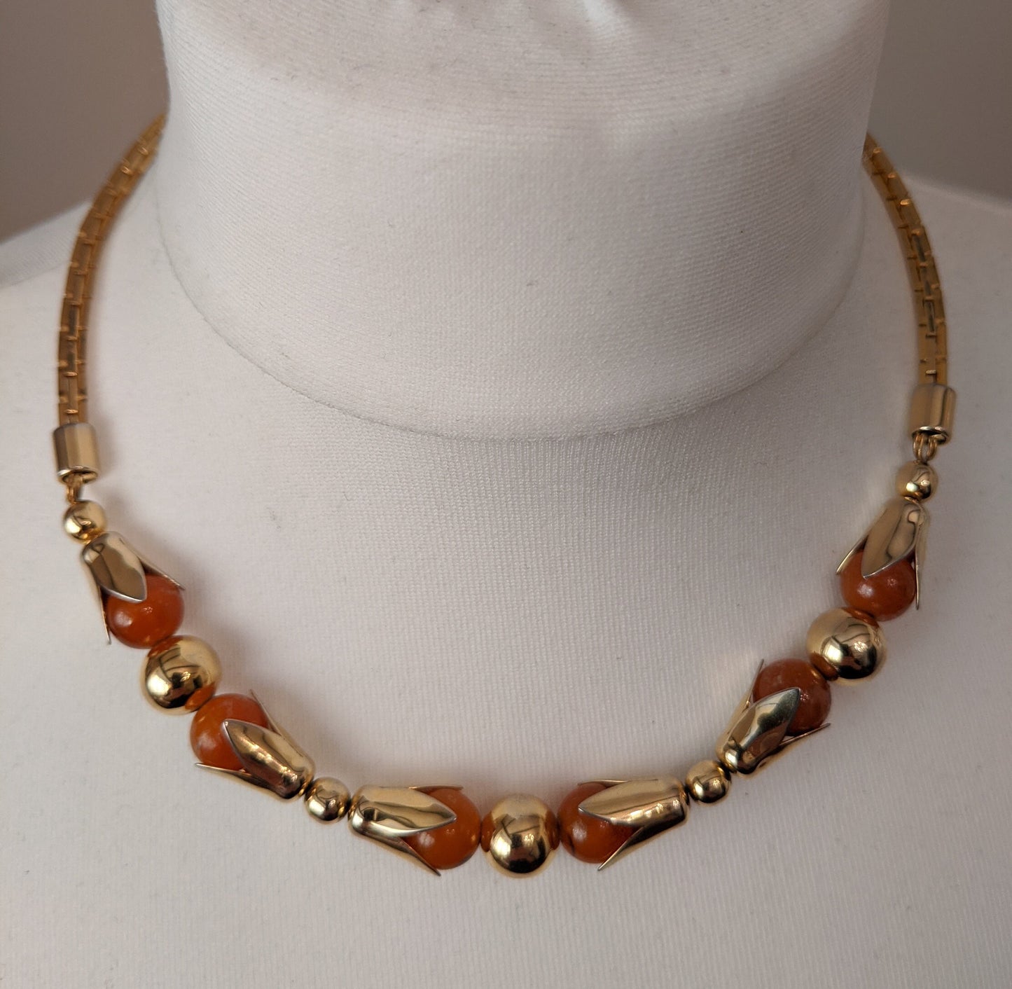 Vintage Jakob Bengel Art Deco machine age gold tone and salmon orange / peach galalith geometric necklace in as new condition